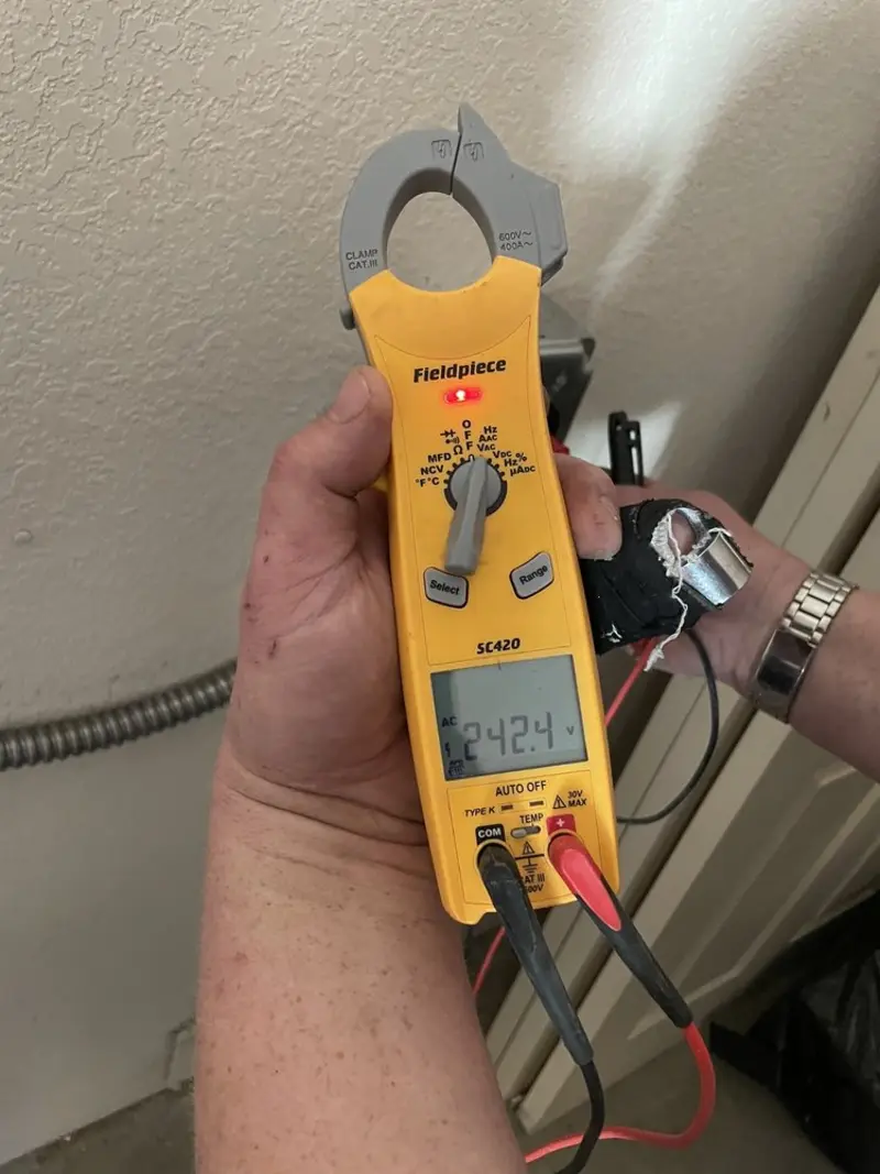 Voltage testing with clamp meter during Recessed Lighting Installation in Pomona